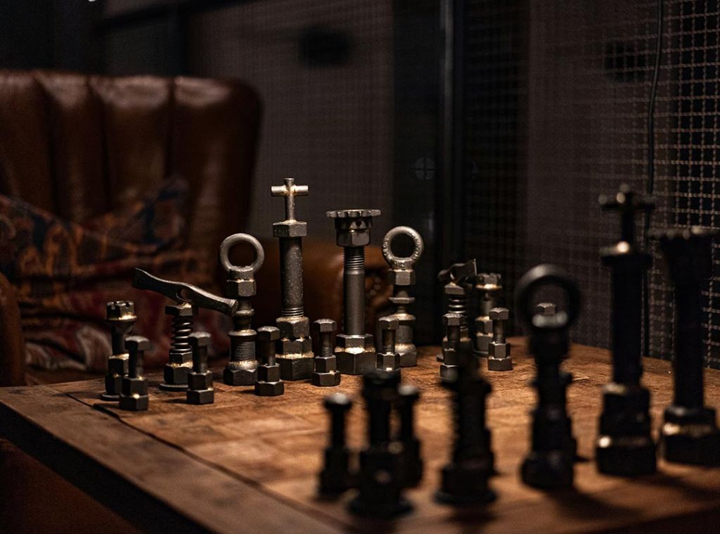 chess board with metal pieces
