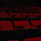 Things IT People Notice in Movies | GC Network Solutions Rows of seats inside a movie theater before a film